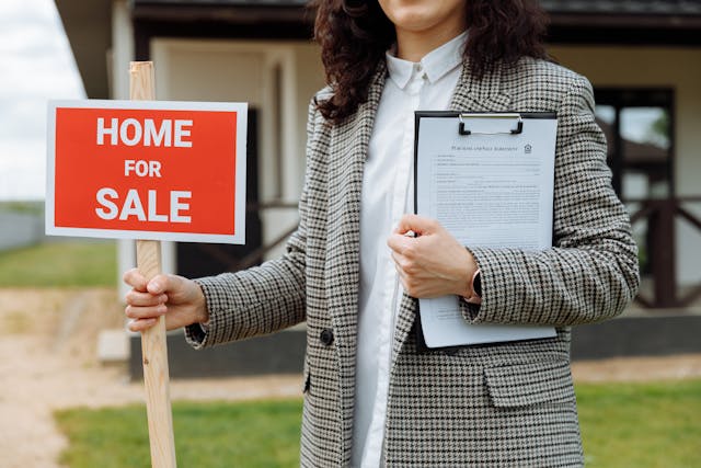 an%20agent%20holding%20a%20for%20sale%20sign an%20agent%20holding%20a%20for%20sale%20sign